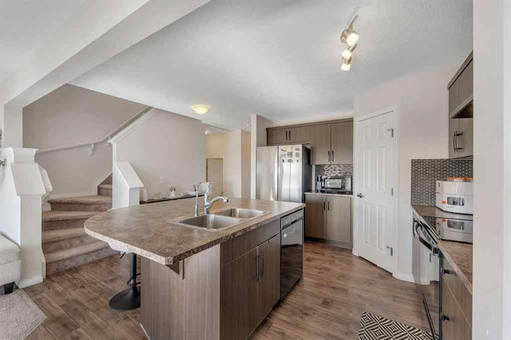 MLS® A2266017 - 209 Hillcrest Square SW in Hillcrest Airdrie, Residential