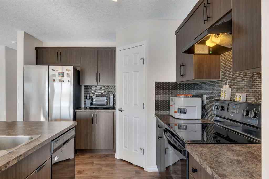 MLS® A2266017 - 209 Hillcrest Square SW in Hillcrest Airdrie, Residential
