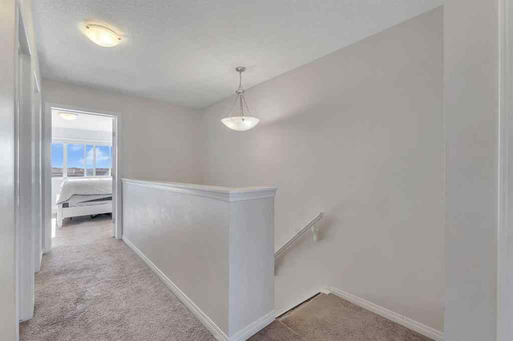 MLS® A2266017 - 209 Hillcrest Square SW in Hillcrest Airdrie, Residential