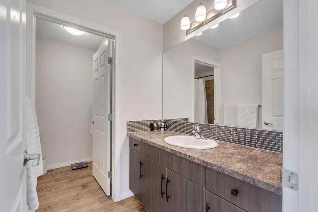 MLS® A2266017 - 209 Hillcrest Square SW in Hillcrest Airdrie, Residential