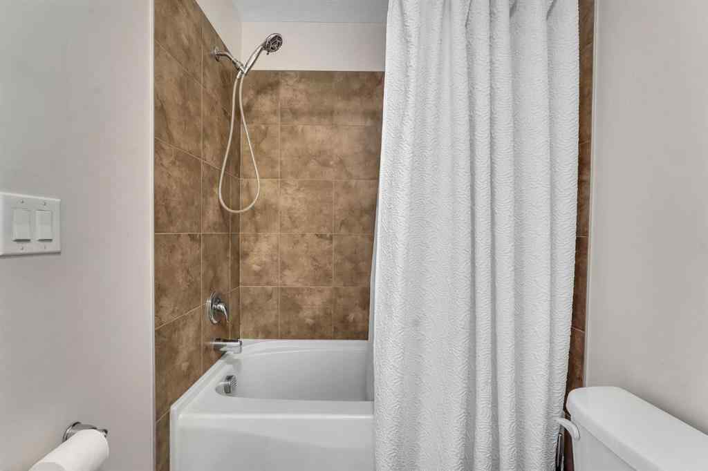 MLS® A2266017 - 209 Hillcrest Square SW in Hillcrest Airdrie, Residential