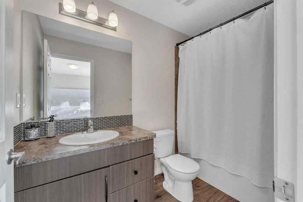 MLS® A2266017 - 209 Hillcrest Square SW in Hillcrest Airdrie, Residential