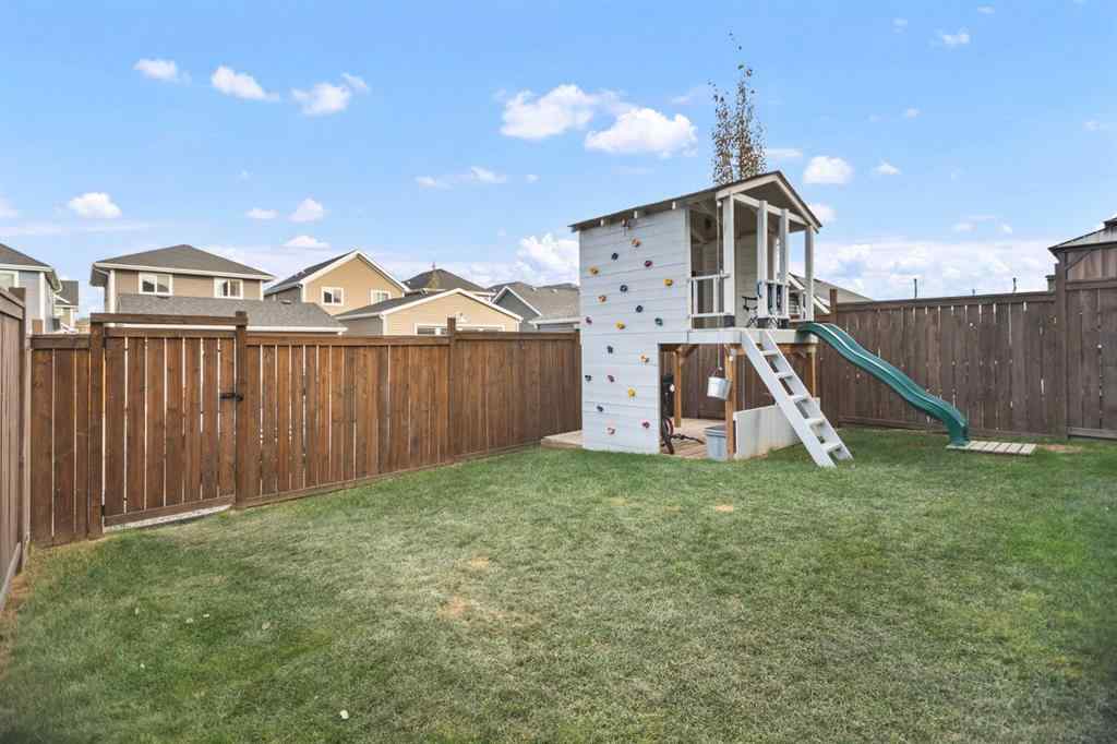 MLS® A2266090 - 411 River Heights Crescent  in River Song Cochrane, Residential