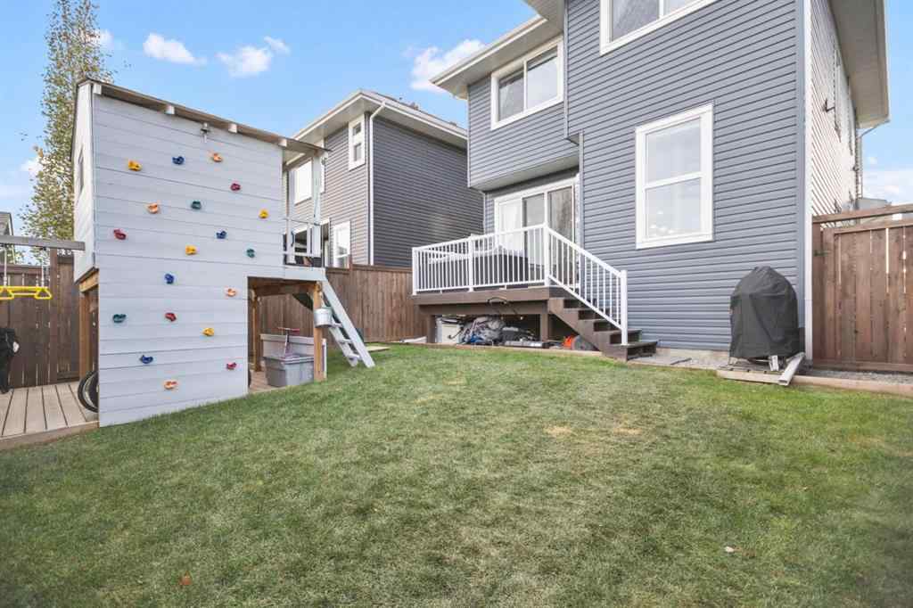 MLS® A2266090 - 411 River Heights Crescent  in River Song Cochrane, Residential