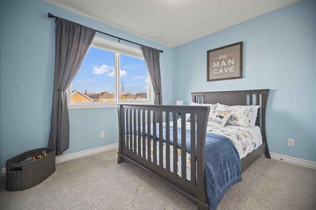 MLS® A2266090 - 411 River Heights Crescent  in River Song Cochrane, Residential