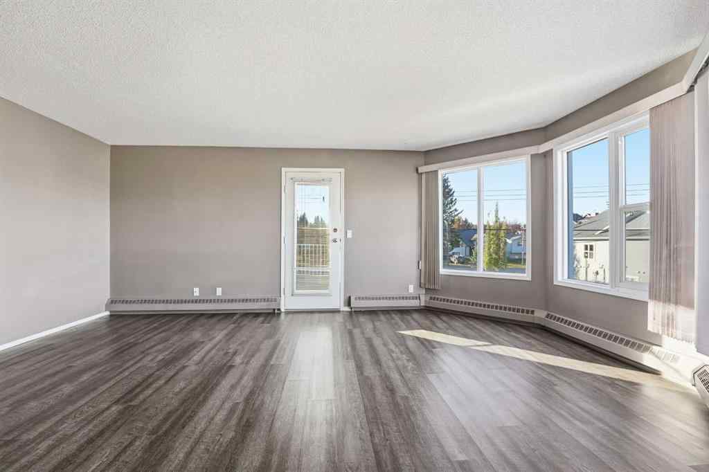 MLS® A2266098 - Unit #208 5135 Lakeshore Drive  in Downtown Sylvan Lake, Residential