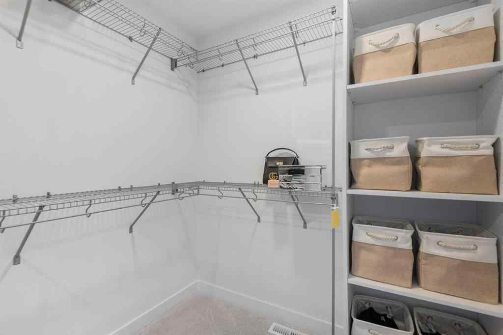 MLS® A2266099 - 8305 8 Avenue SW in West Springs Calgary, Residential