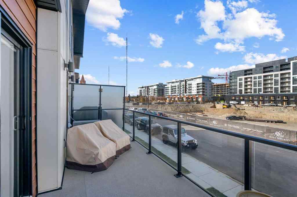 MLS® A2266099 - 8305 8 Avenue SW in West Springs Calgary, Residential