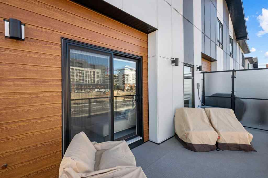 MLS® A2266099 - 8305 8 Avenue SW in West Springs Calgary, Residential