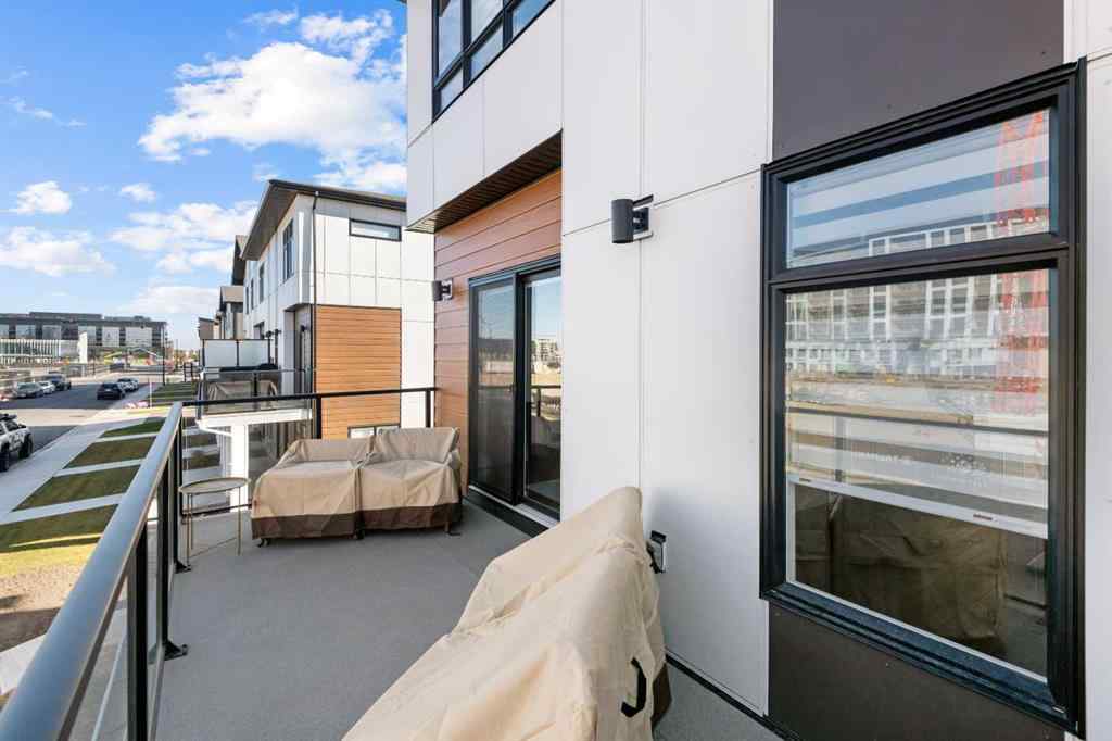 MLS® A2266099 - 8305 8 Avenue SW in West Springs Calgary, Residential