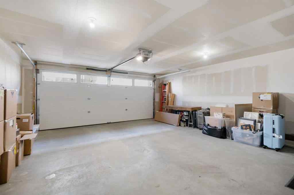 MLS® A2266099 - 8305 8 Avenue SW in West Springs Calgary, Residential