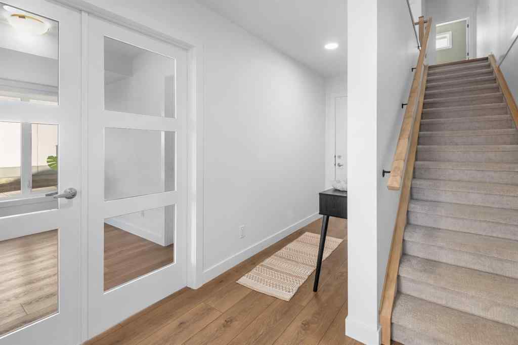 MLS® A2266099 - 8305 8 Avenue SW in West Springs Calgary, Residential