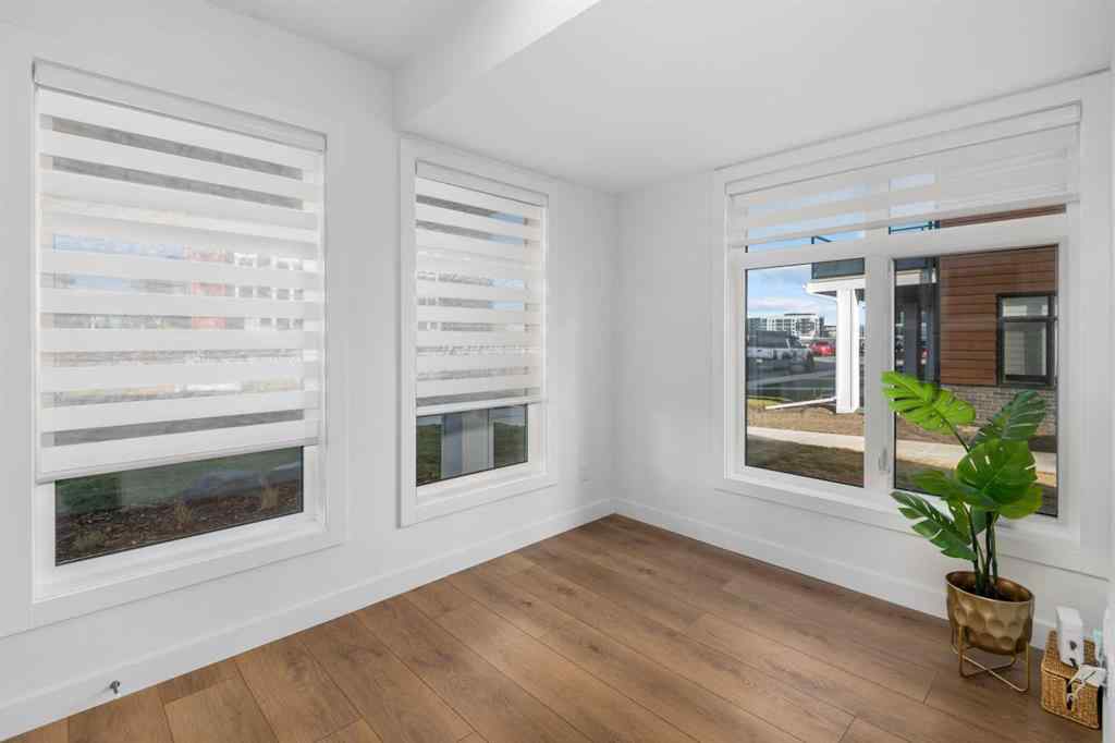 MLS® A2266099 - 8305 8 Avenue SW in West Springs Calgary, Residential