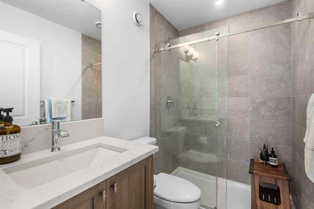 MLS® A2266099 - 8305 8 Avenue SW in West Springs Calgary, Residential