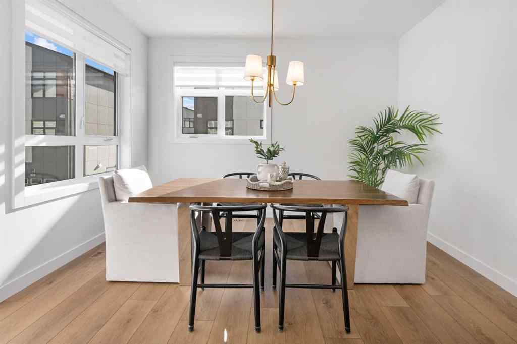 MLS® A2266099 - 8305 8 Avenue SW in West Springs Calgary, Residential