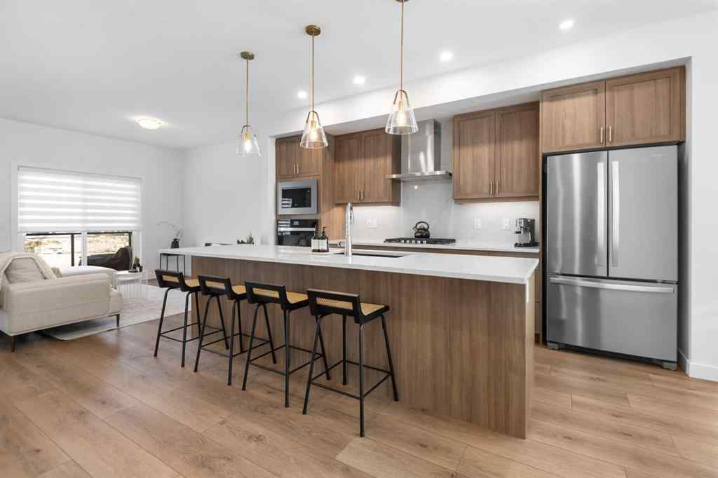 MLS® A2266099 - 8305 8 Avenue SW in West Springs Calgary, Residential