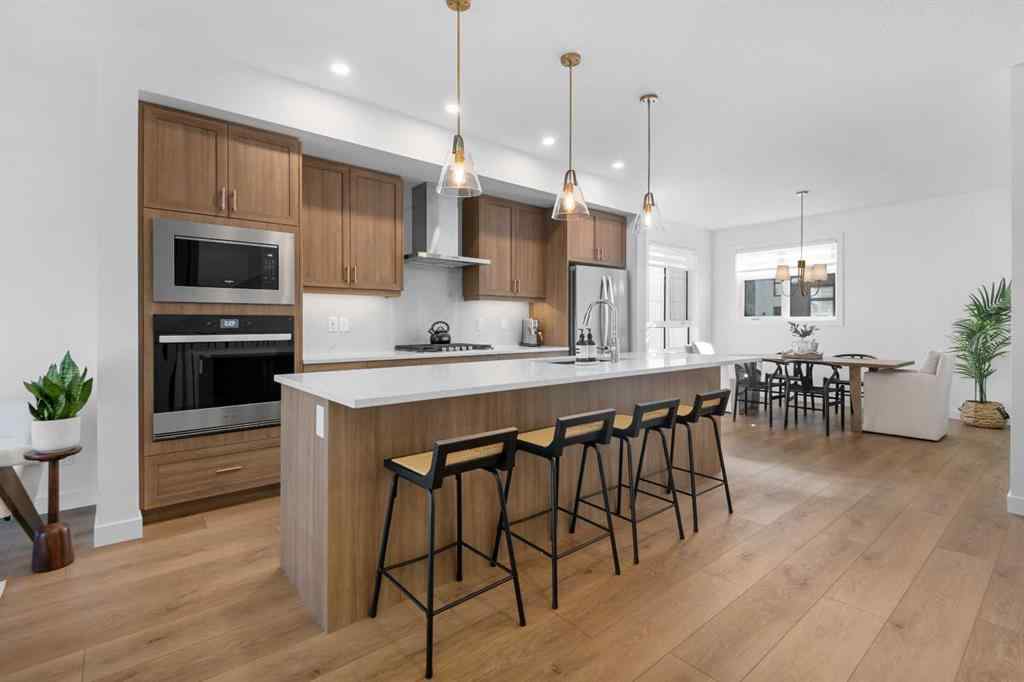 MLS® A2266099 - 8305 8 Avenue SW in West Springs Calgary, Residential