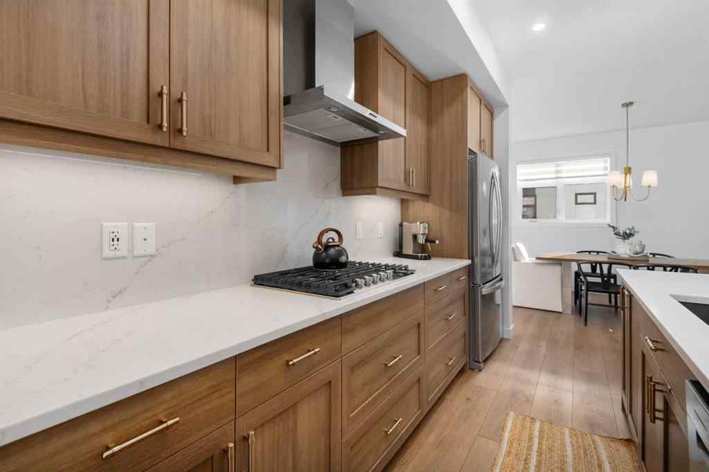 MLS® A2266099 - 8305 8 Avenue SW in West Springs Calgary, Residential