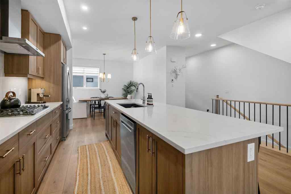 MLS® A2266099 - 8305 8 Avenue SW in West Springs Calgary, Residential