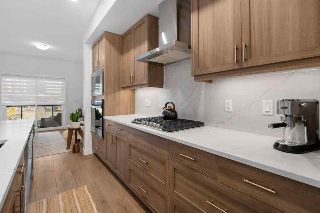 MLS® A2266099 - 8305 8 Avenue SW in West Springs Calgary, Residential