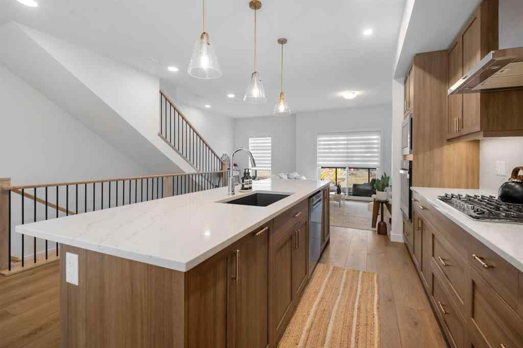 MLS® A2266099 - 8305 8 Avenue SW in West Springs Calgary, Residential