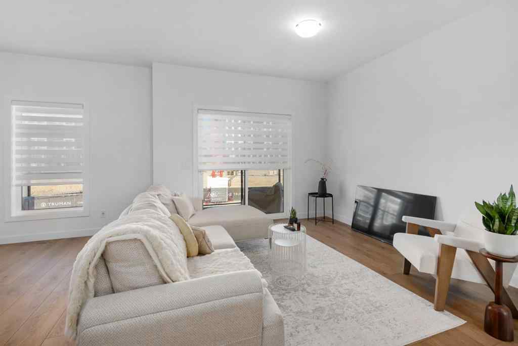 MLS® A2266099 - 8305 8 Avenue SW in West Springs Calgary, Residential