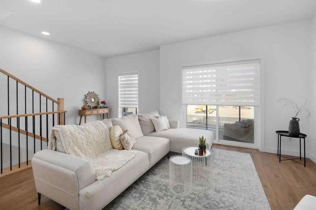 MLS® A2266099 - 8305 8 Avenue SW in West Springs Calgary, Residential