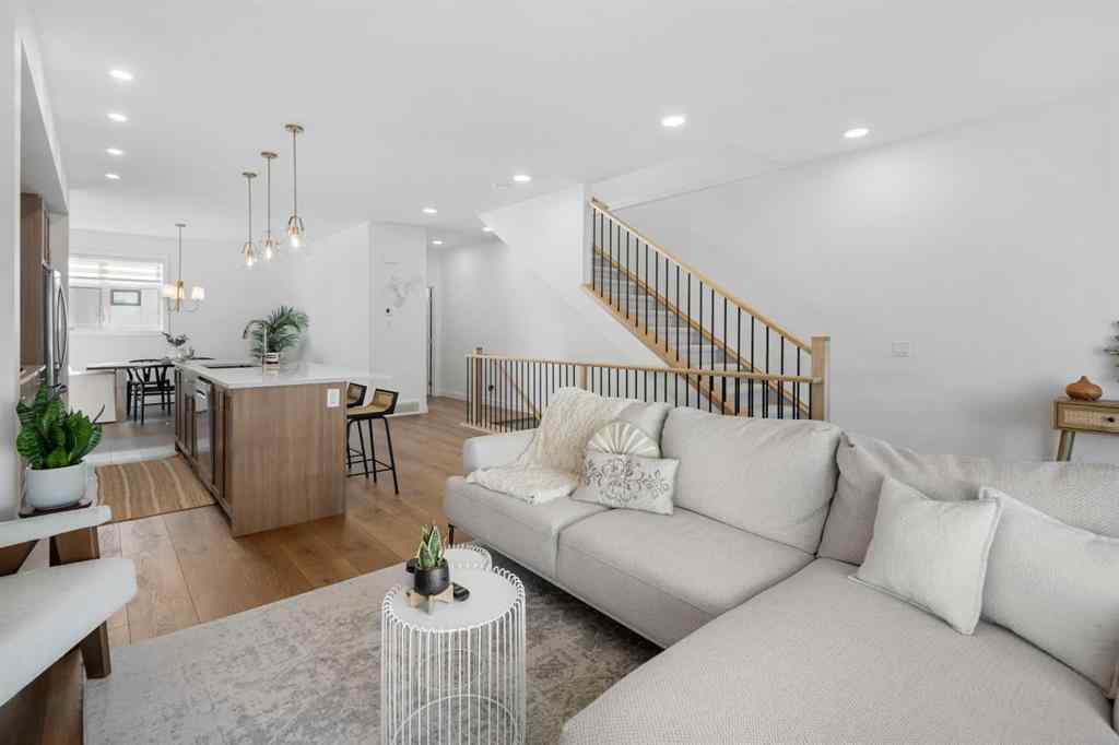 MLS® A2266099 - 8305 8 Avenue SW in West Springs Calgary, Residential