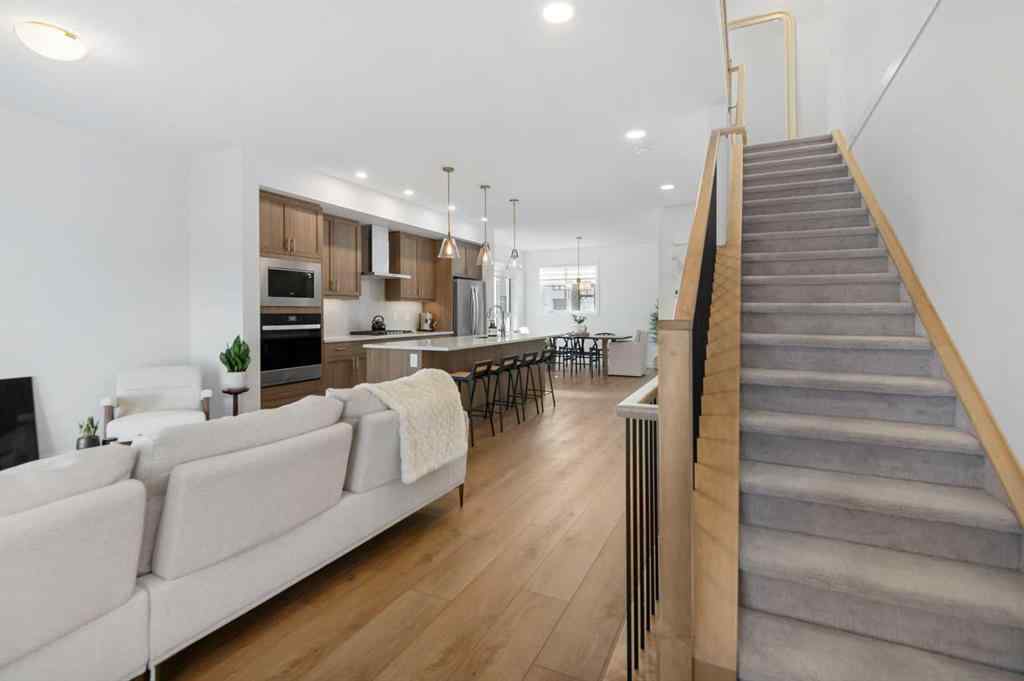 MLS® A2266099 - 8305 8 Avenue SW in West Springs Calgary, Residential