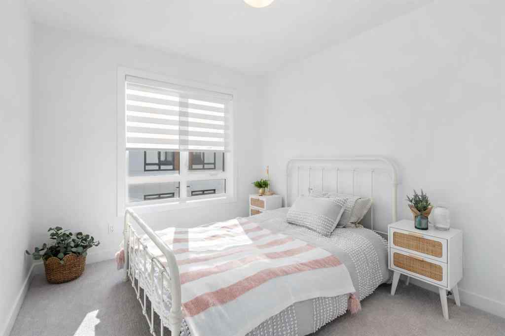 MLS® A2266099 - 8305 8 Avenue SW in West Springs Calgary, Residential