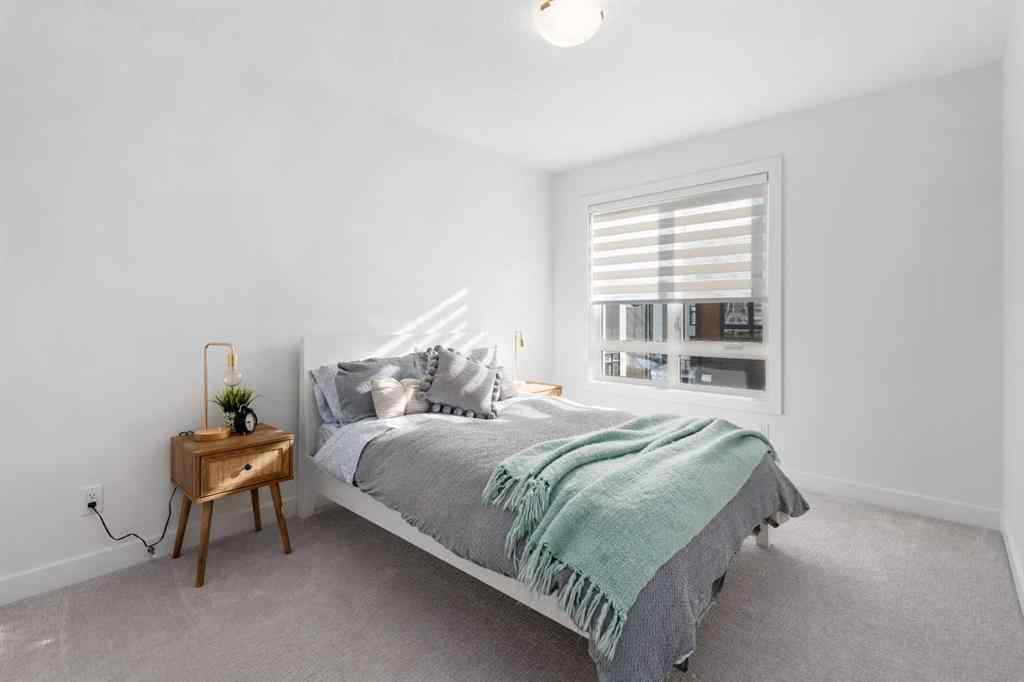 MLS® A2266099 - 8305 8 Avenue SW in West Springs Calgary, Residential