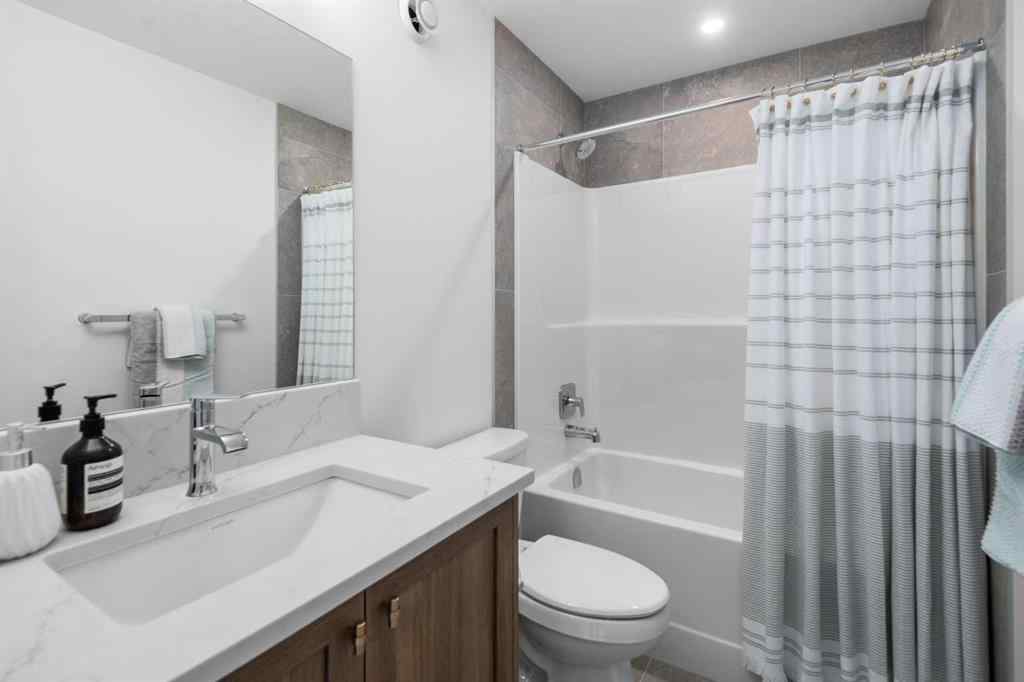 MLS® A2266099 - 8305 8 Avenue SW in West Springs Calgary, Residential