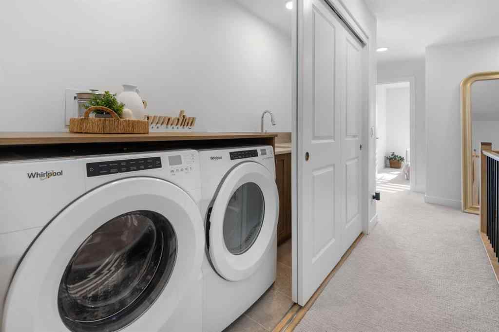 MLS® A2266099 - 8305 8 Avenue SW in West Springs Calgary, Residential