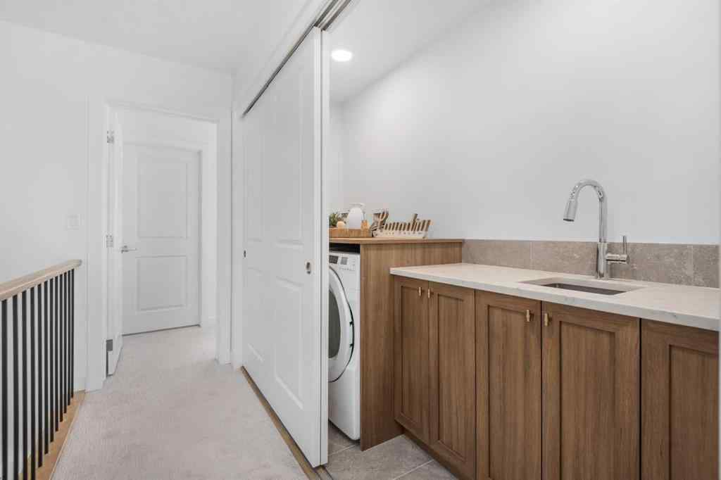 MLS® A2266099 - 8305 8 Avenue SW in West Springs Calgary, Residential