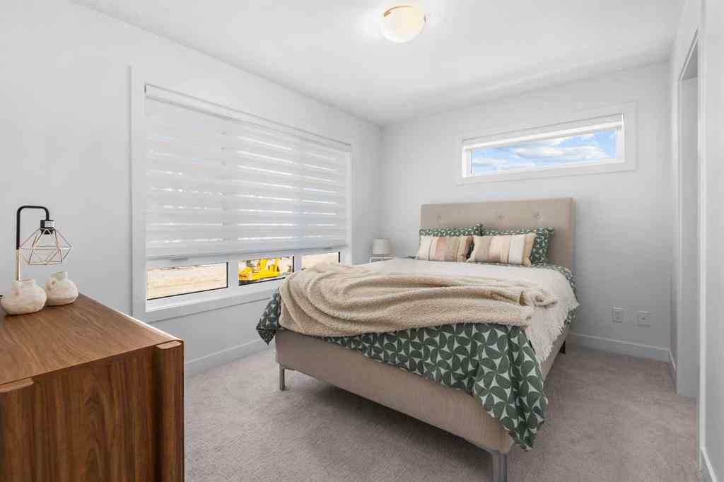 MLS® A2266099 - 8305 8 Avenue SW in West Springs Calgary, Residential