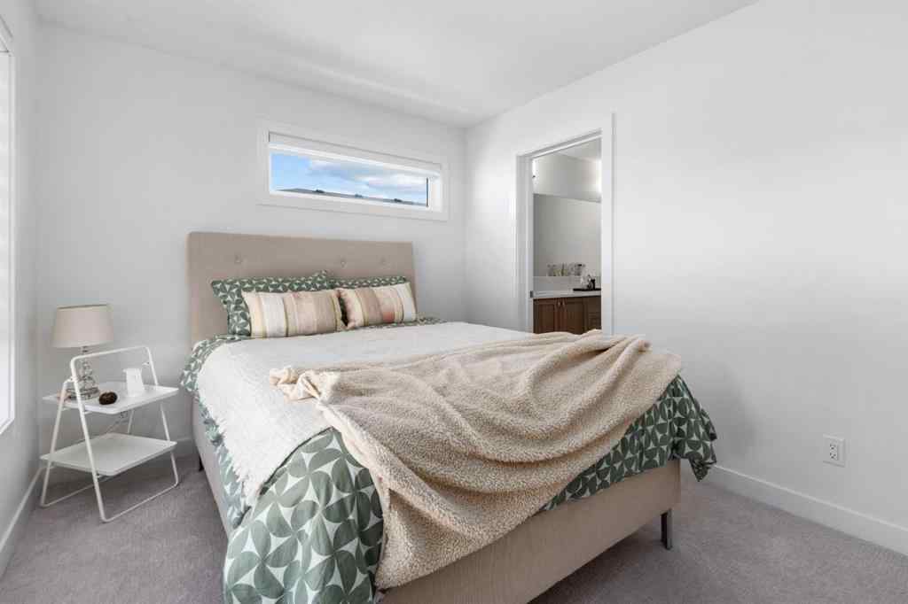 MLS® A2266099 - 8305 8 Avenue SW in West Springs Calgary, Residential