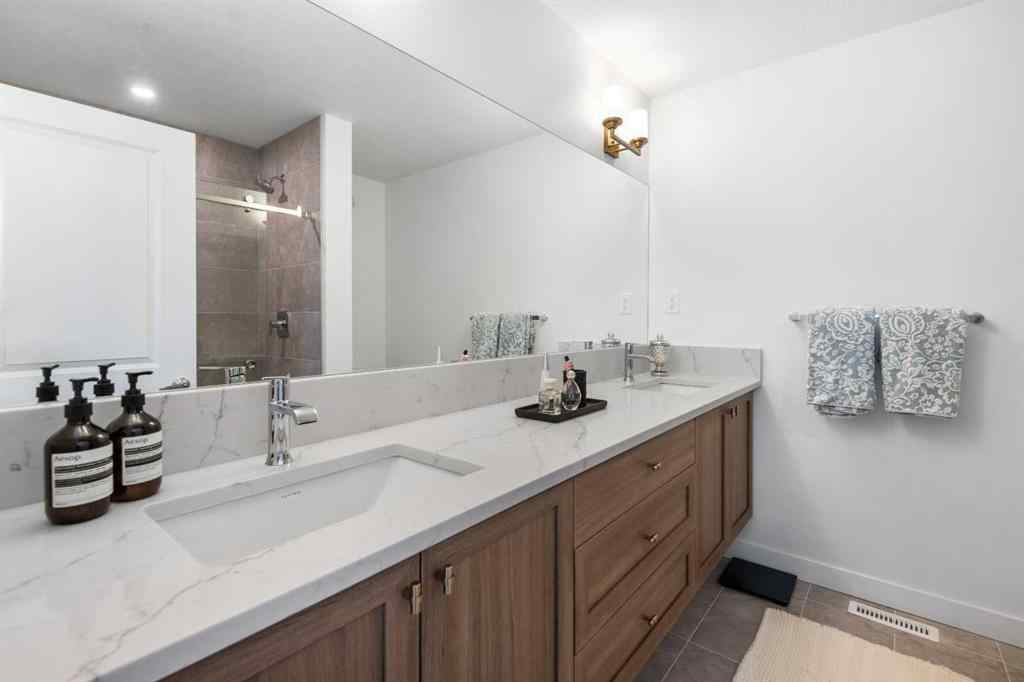 MLS® A2266099 - 8305 8 Avenue SW in West Springs Calgary, Residential