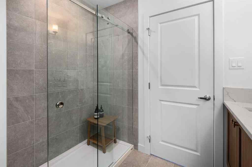MLS® A2266099 - 8305 8 Avenue SW in West Springs Calgary, Residential
