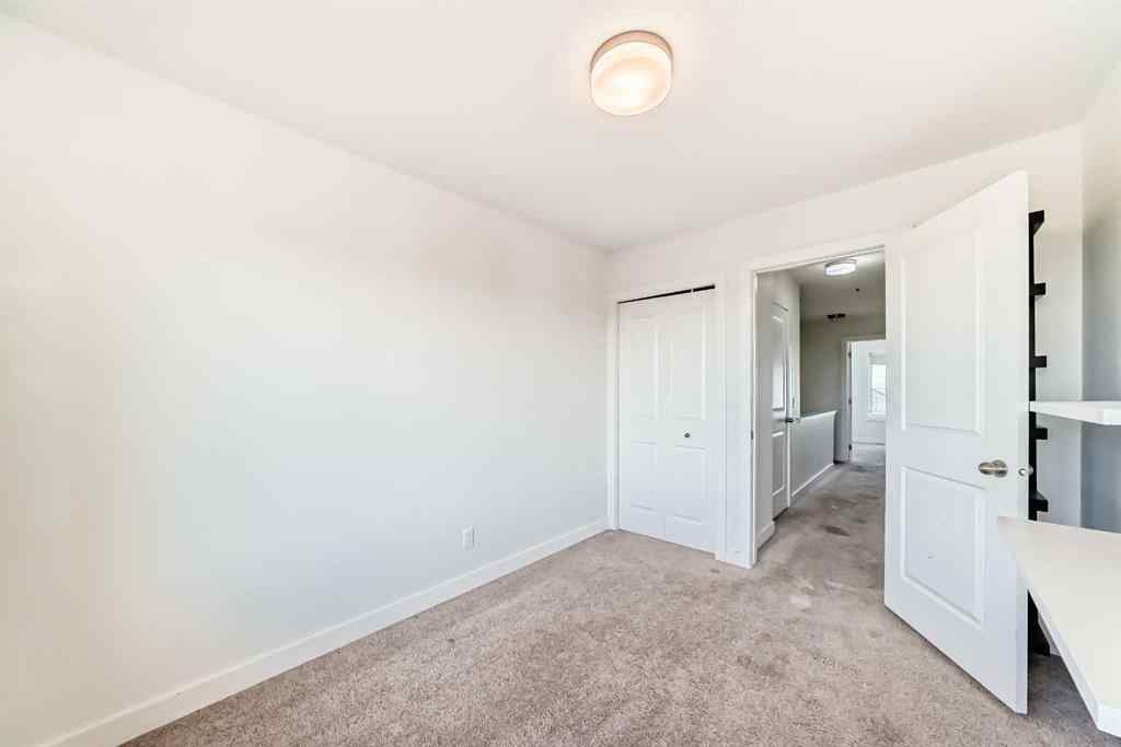 MLS® A2266106 - Unit #129 2802 Kings Heights Gate SE in Ravenswood Airdrie, Residential