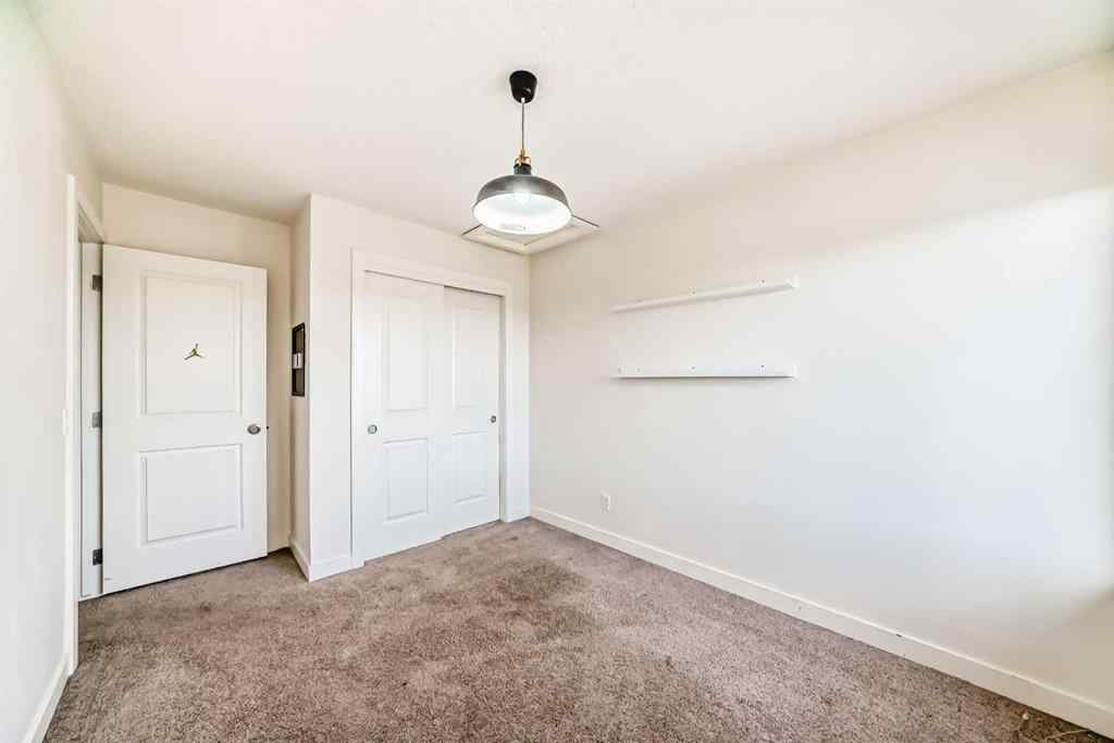 MLS® A2266106 - Unit #129 2802 Kings Heights Gate SE in Ravenswood Airdrie, Residential