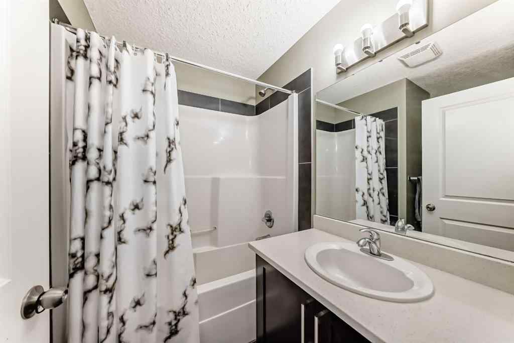 MLS® A2266106 - Unit #129 2802 Kings Heights Gate SE in Ravenswood Airdrie, Residential