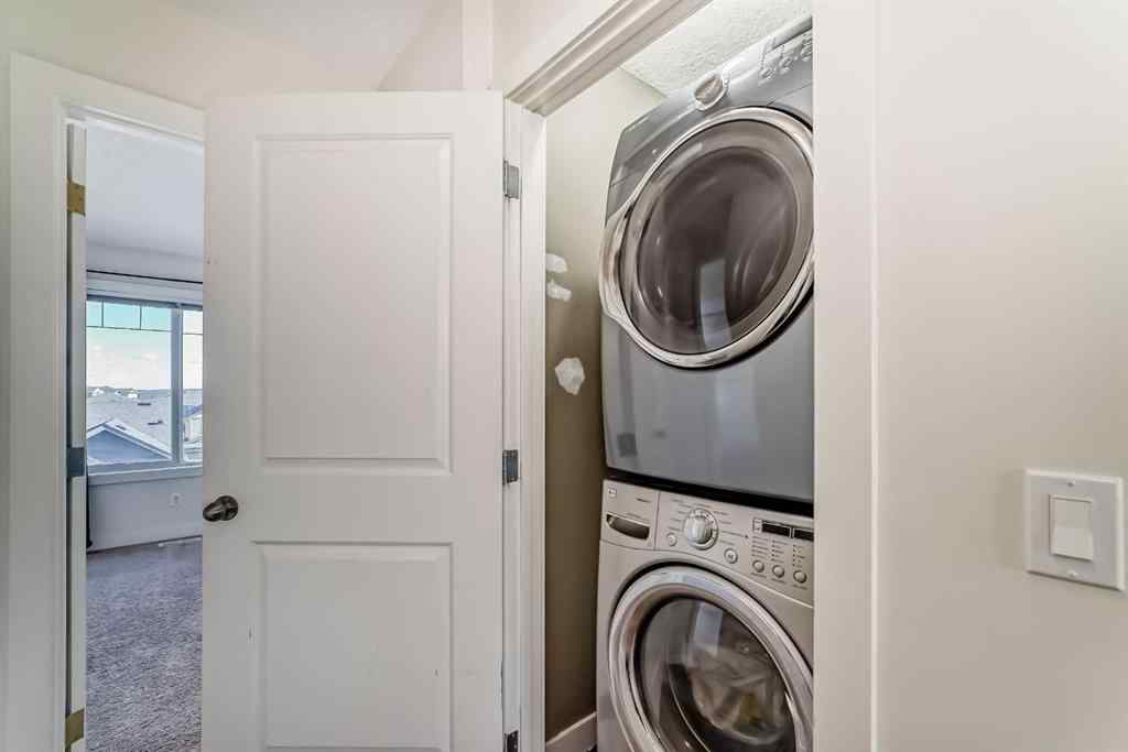 MLS® A2266106 - Unit #129 2802 Kings Heights Gate SE in Ravenswood Airdrie, Residential