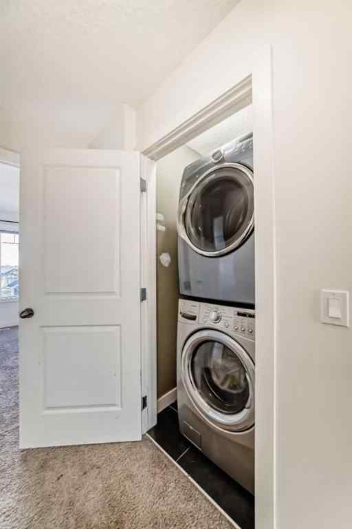 MLS® A2266106 - Unit #129 2802 Kings Heights Gate SE in Ravenswood Airdrie, Residential