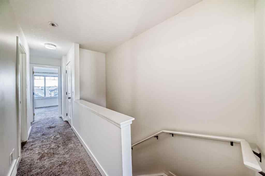 MLS® A2266106 - Unit #129 2802 Kings Heights Gate SE in Ravenswood Airdrie, Residential