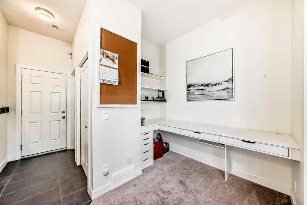 MLS® A2266106 - Unit #129 2802 Kings Heights Gate SE in Ravenswood Airdrie, Residential