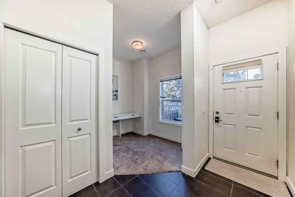 MLS® A2266106 - Unit #129 2802 Kings Heights Gate SE in Ravenswood Airdrie, Residential