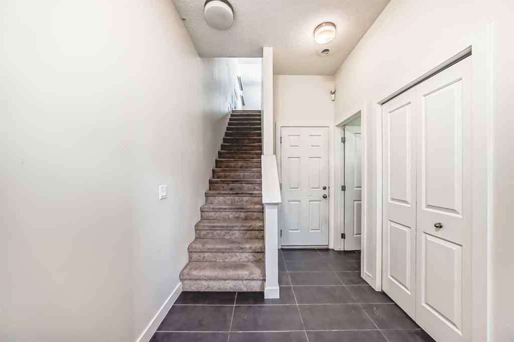 MLS® A2266106 - Unit #129 2802 Kings Heights Gate SE in Ravenswood Airdrie, Residential