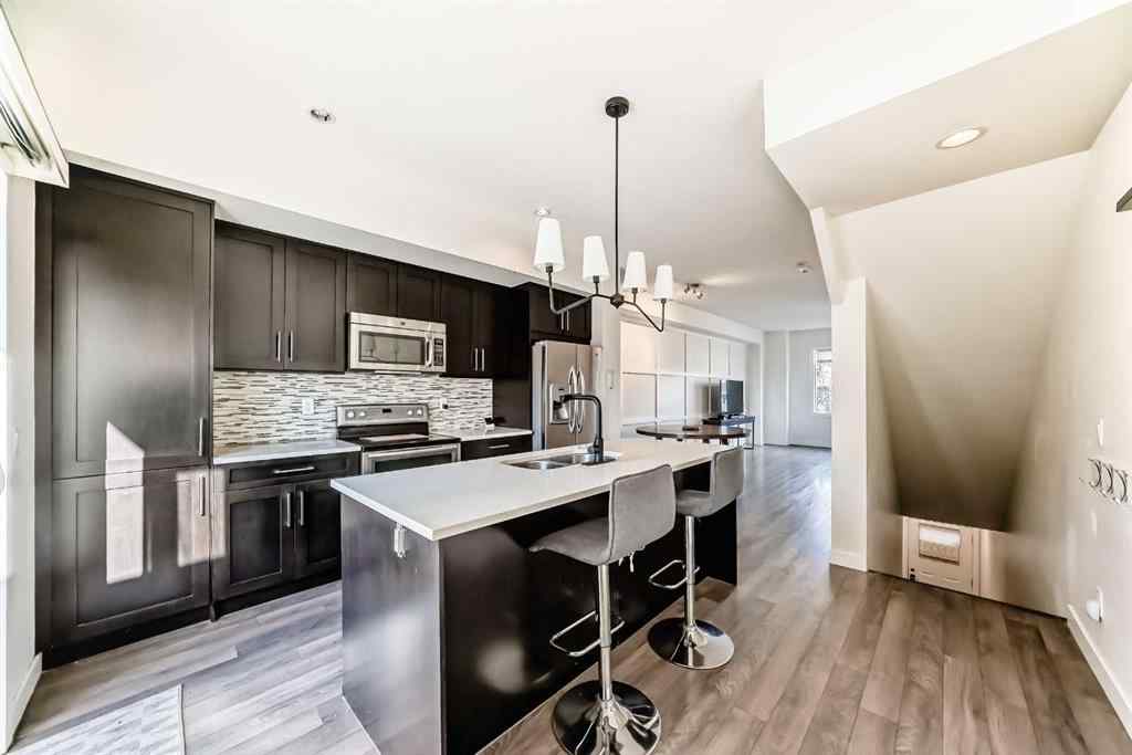 MLS® A2266106 - Unit #129 2802 Kings Heights Gate SE in Ravenswood Airdrie, Residential