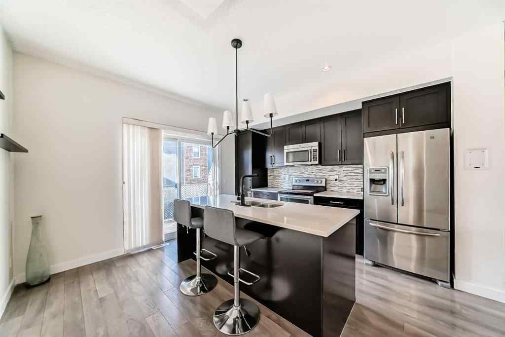 MLS® A2266106 - Unit #129 2802 Kings Heights Gate SE in Ravenswood Airdrie, Residential