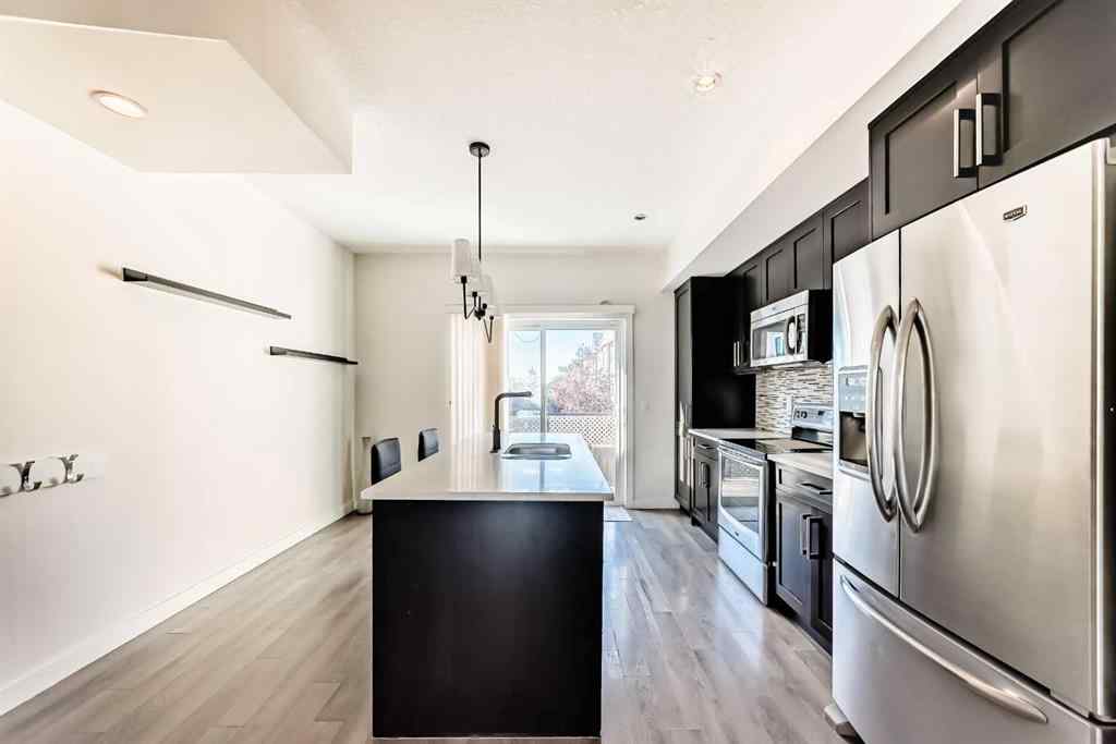 MLS® A2266106 - Unit #129 2802 Kings Heights Gate SE in Ravenswood Airdrie, Residential